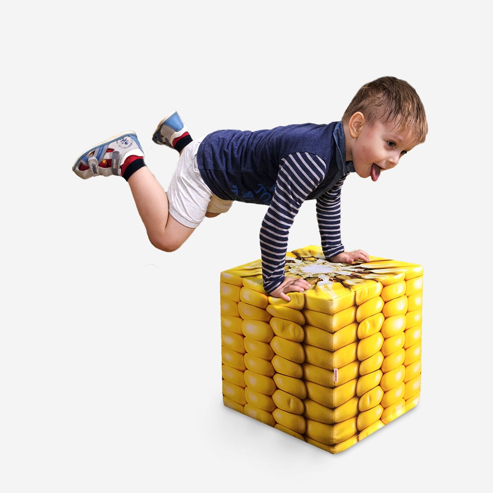 Boy-is-standing-on-corn-cube-on-a-white-background.jpg