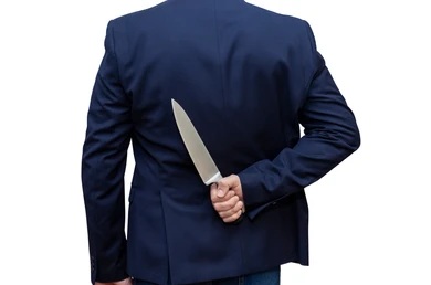 businessman-holding-knife-behind-his-260nw-1619126767.jpg